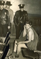 Rioting servicemen stripped some zoot suiters of their clothes in public. According to the Examiner's caption, this arrested teenager took the turn of events 'philosophically.' Courtesy of the Los Angeles Examiner Collection, USC Libraries.